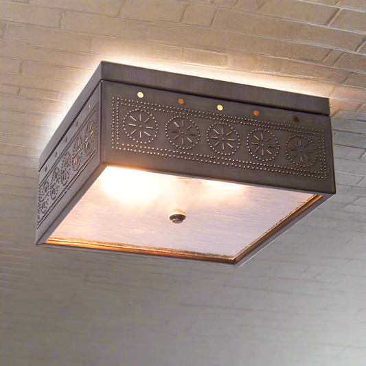 Decorative ceiling light fixture with intricate design on a white background