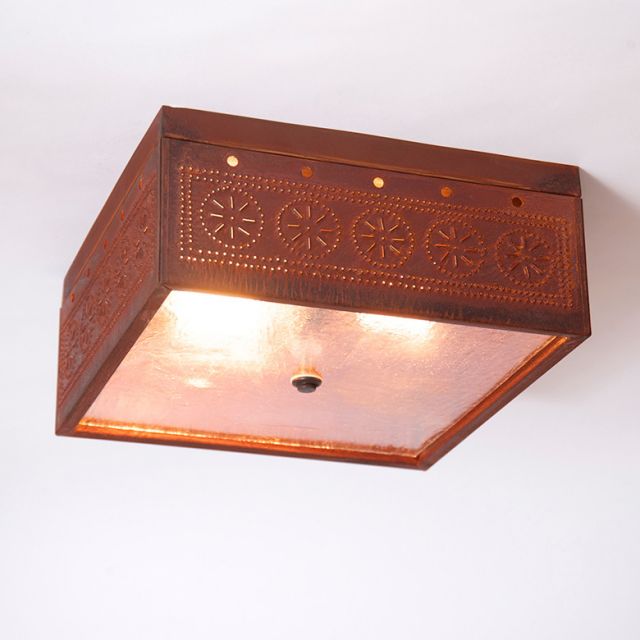 Rustic tin ceiling light fixture with embossed design on a white background
