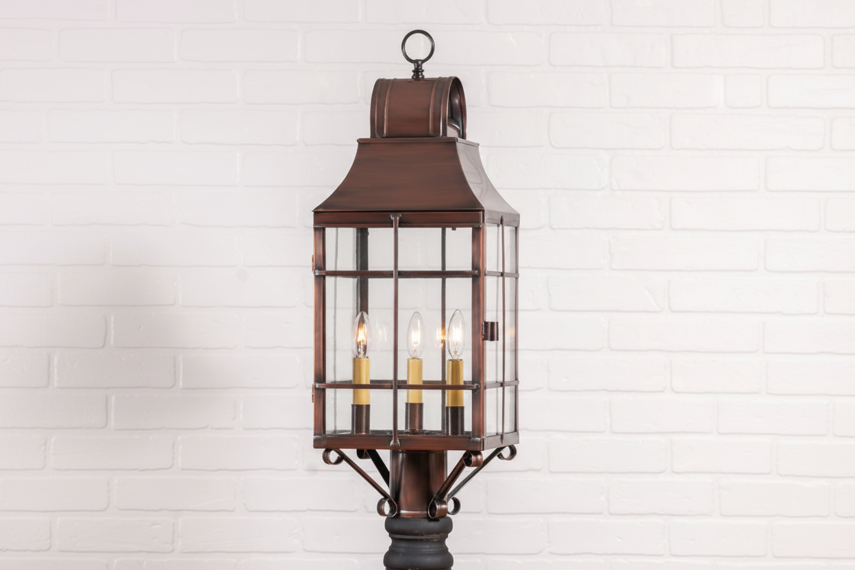 Decorative outdoor lantern with glass panels on a white brick wall background