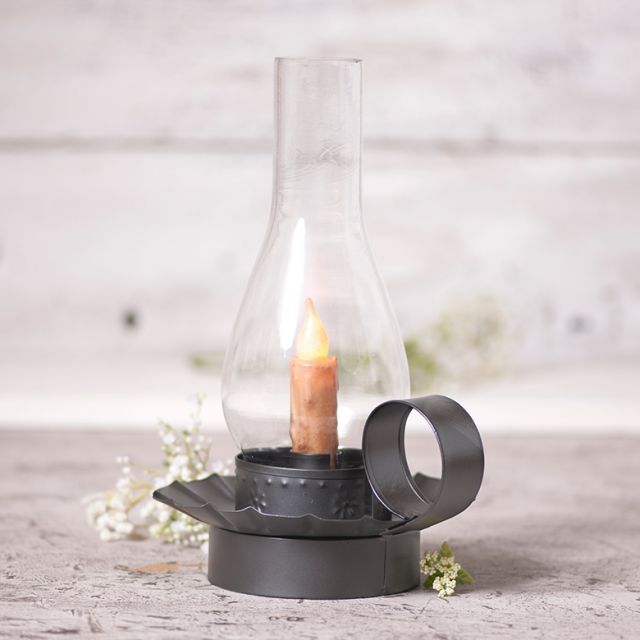 Tin candleholder with globe to accommodate a real or battery operated taper candle.