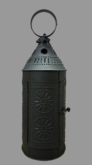 A black textured metal lantern with a traditional design, featuring a top handle and a front latch, intended for holding a battery operated taper candle.