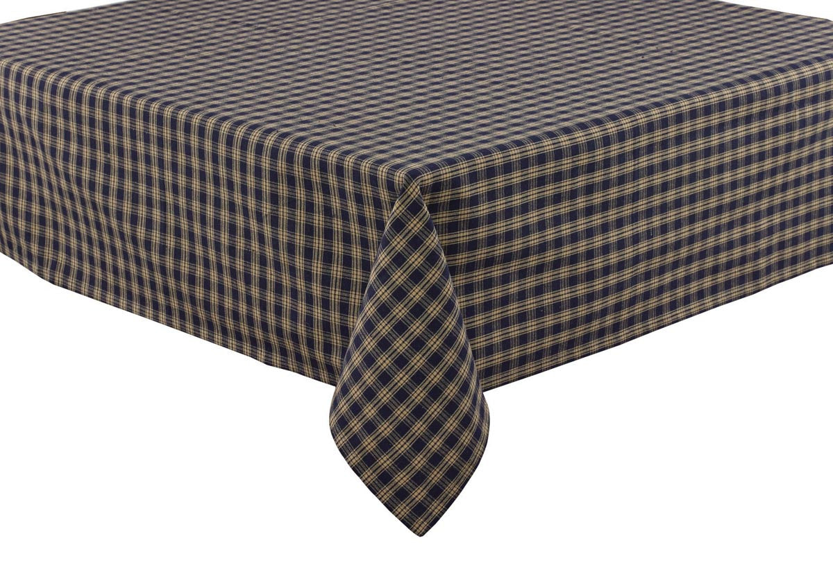 A navy and beige checkered tablecloth on a table.