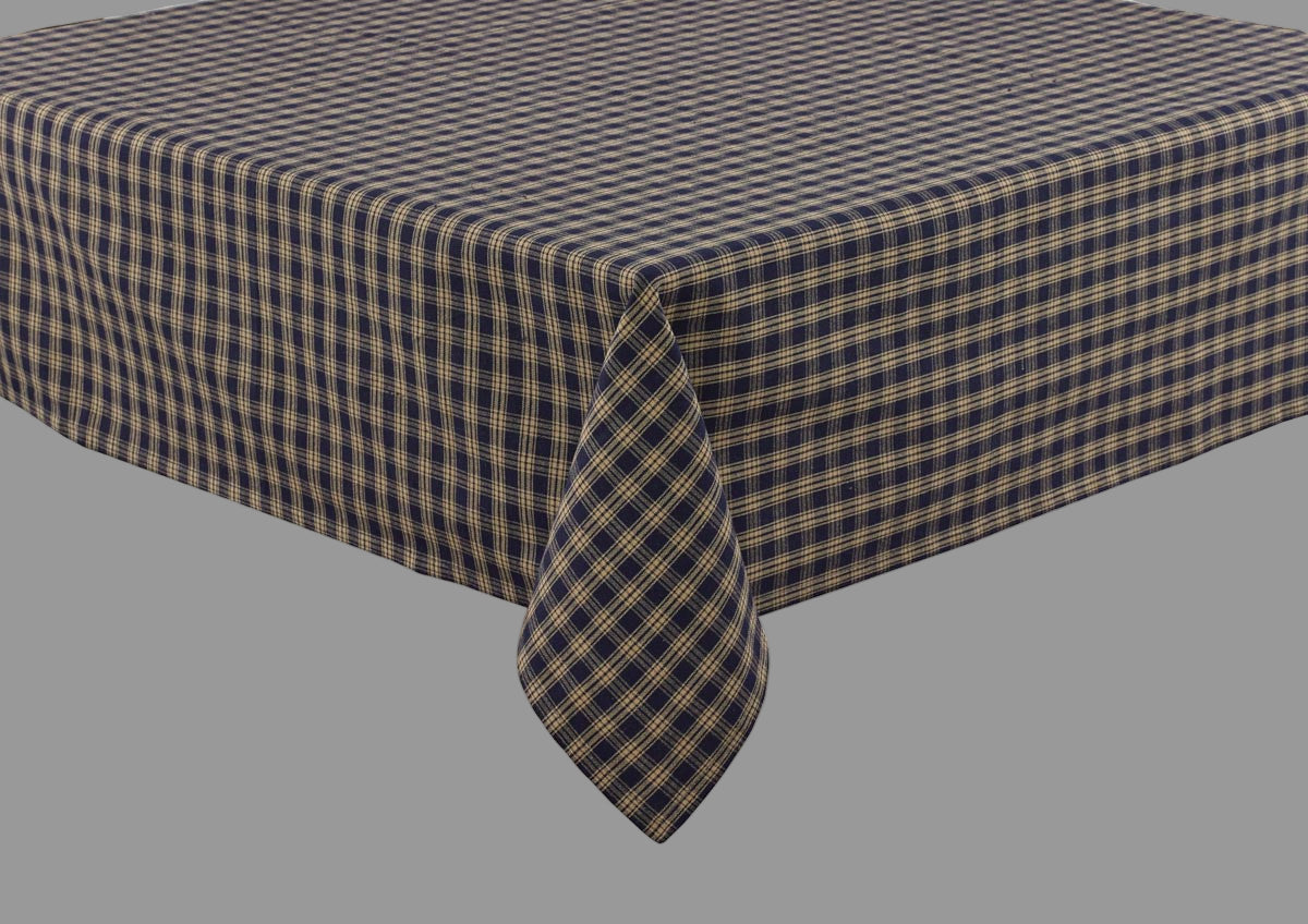 A navy and beige checkered tablecloth on a table.