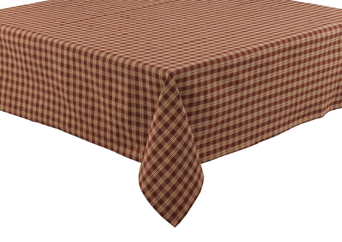 A wine and beige checkered tablecloth on a table.