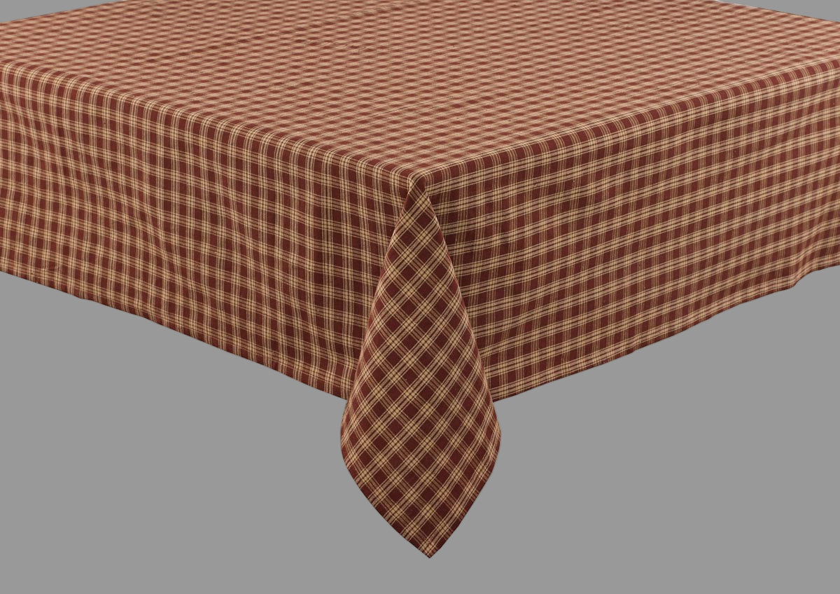 A wine and beige checkered tablecloth on a table.