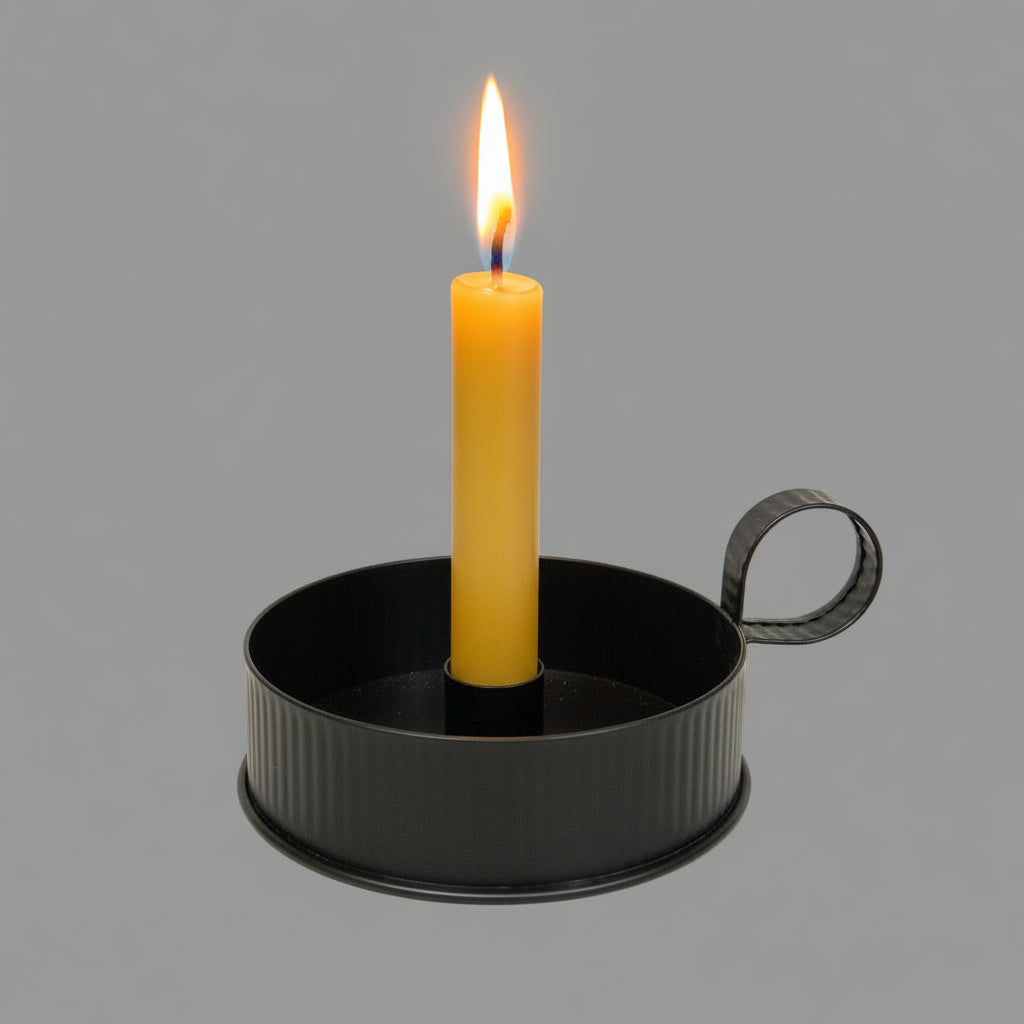 Candle pan with beeswax candle on textured black riser