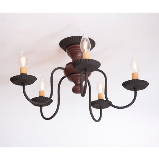 Black chandelier with six candle-style lights on a white background
