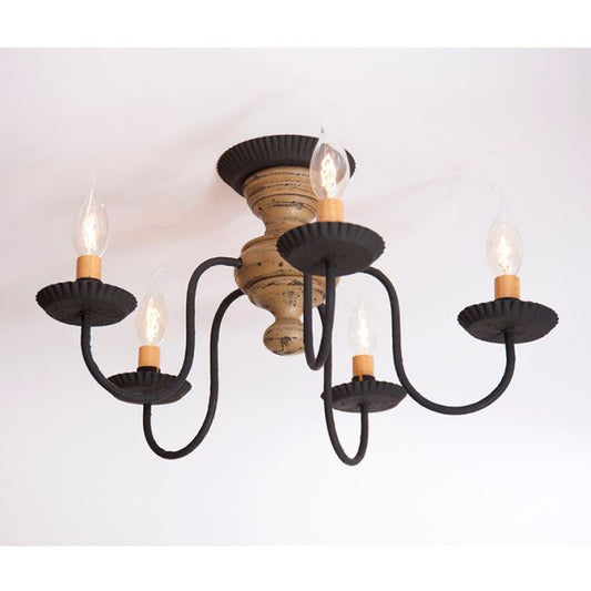 Black metal chandelier with wooden base on a white background