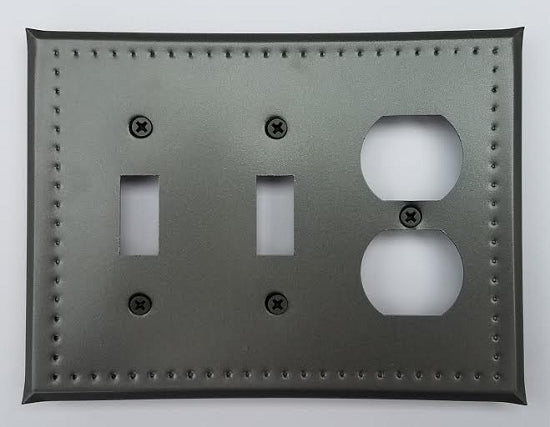 A tin double switch/single outlet border punch with two switch cutouts and one outlet, featuring a gray color and metal material.