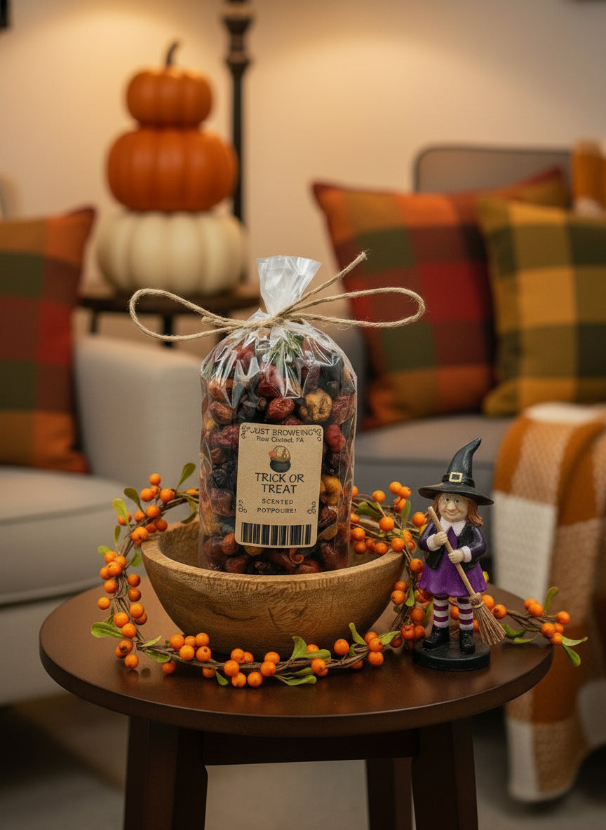 Decorative setup with a bag of dried fruits, a bowl, and a figurine on a table in a cozy living room.