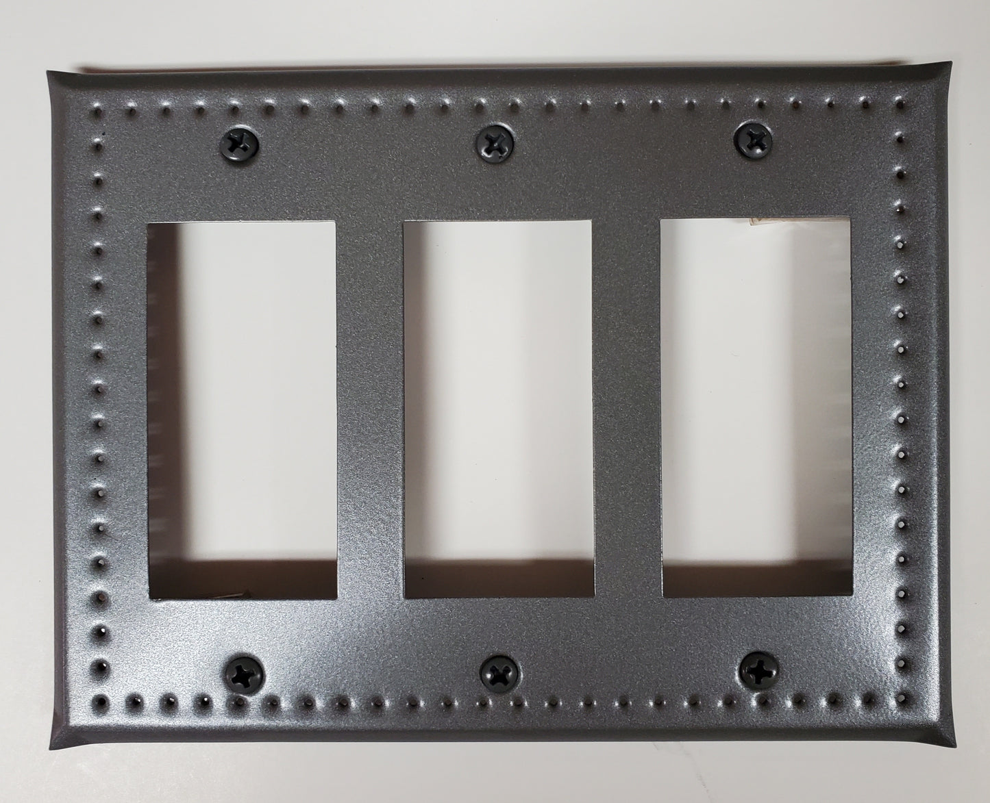 Punched tin cover for wall switch with rectangular cutouts