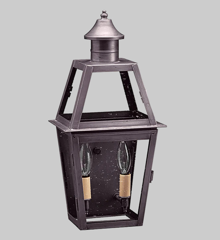 Decorative outdoor lantern with two light bulbs on a gray background
