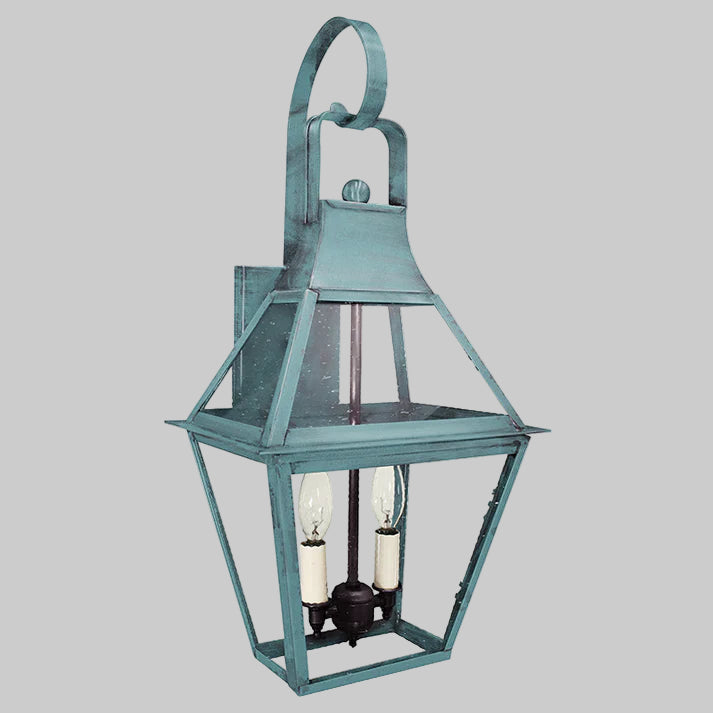 Decorative outdoor lantern with a metal frame on a gray background
