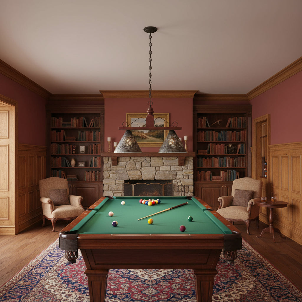 Two light pendant light with punched tin shades in plantation red finish hanging over a pool table.