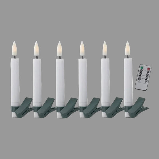 A set of six white LED tree clip candles with green clips and a remote control.