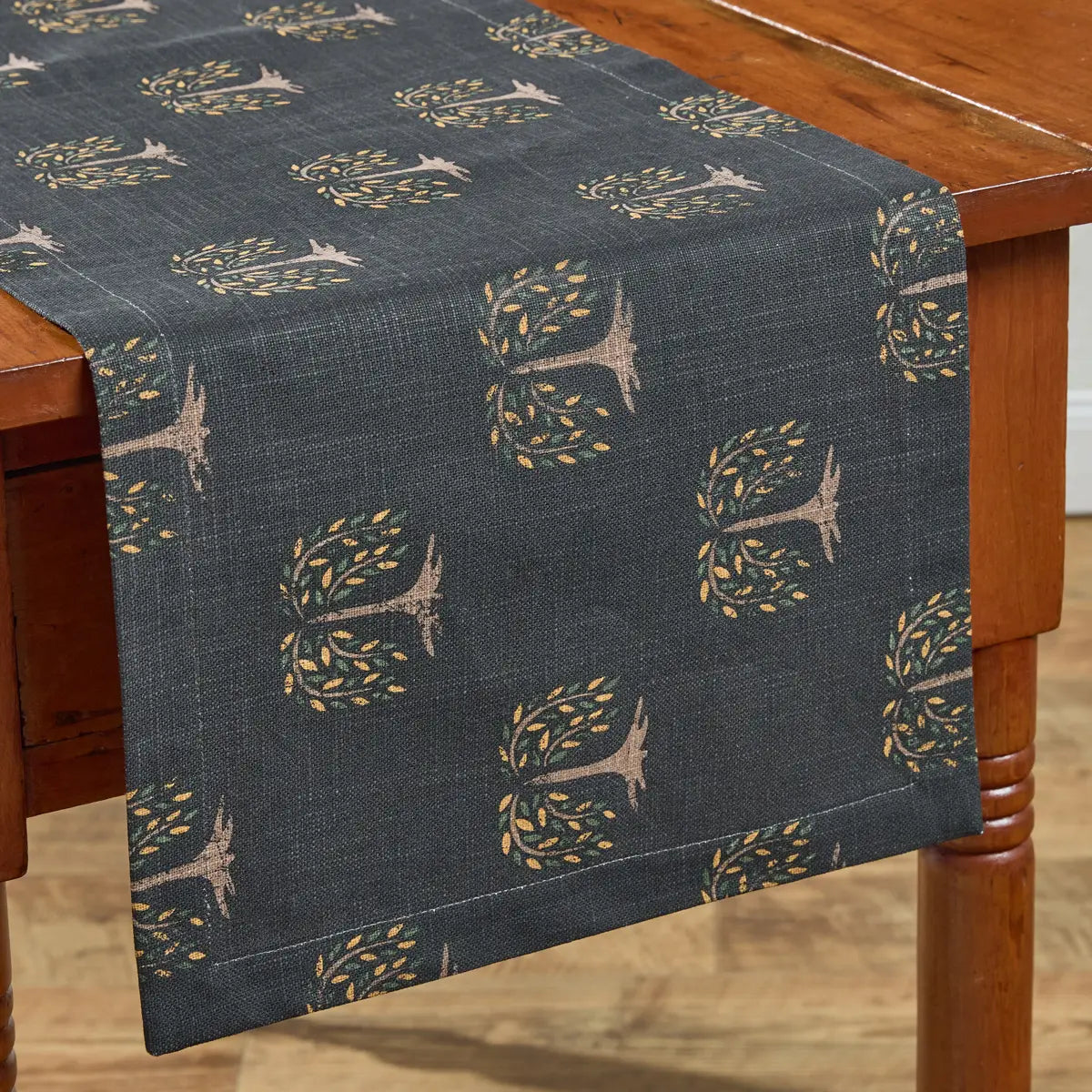 Table runner with tree pattern on a wooden table
