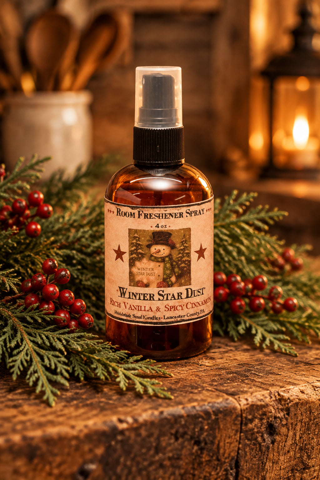 Room freshener spray bottle labeled 'Winter Star Dust' on a wooden surface with a snowy background.