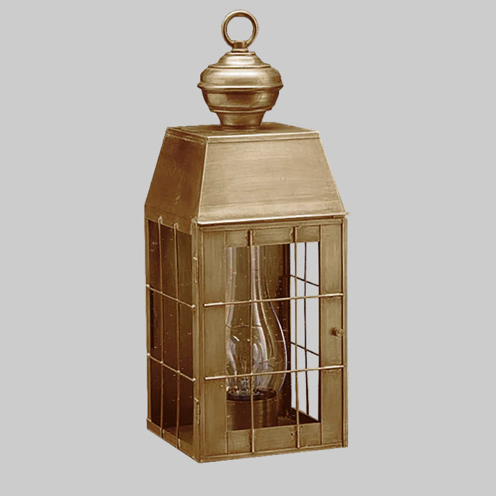 Bronze lantern with a clear glass front on a white background