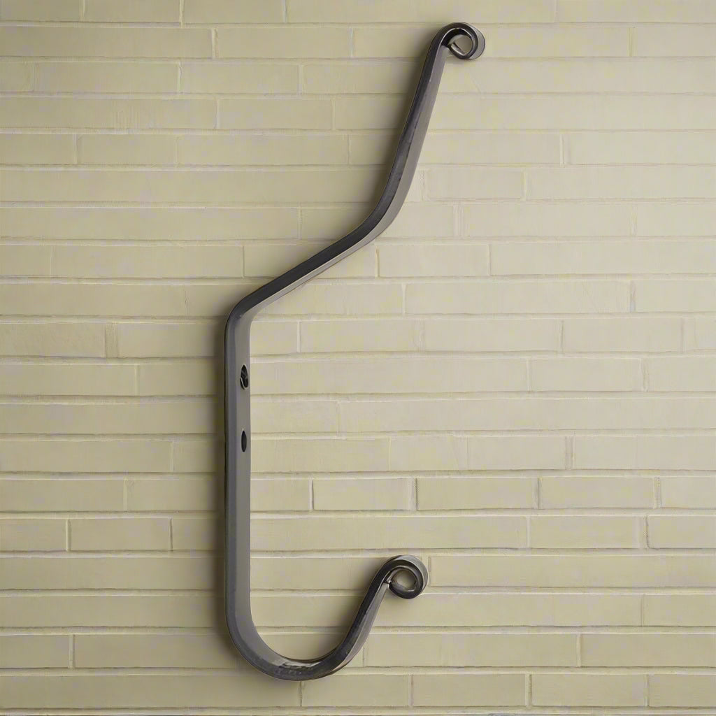 Wrought iron coat hook on white background