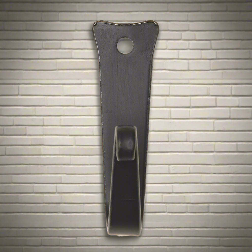 A black wrought iron J hook with a screw hole in the top center, designed for hanging pans in the kitchen.