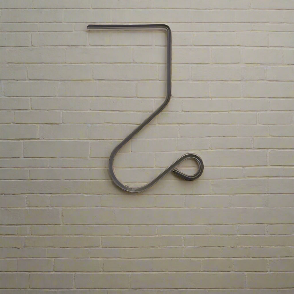 A wrought iron medium mantle hook designed to hold stocking on a mantle, with a curved shape and a solid gray finish.