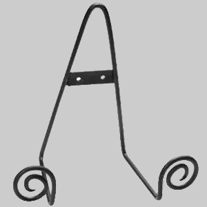 A black wrought iron plate stand with a decorative twisted tail design on the base.
