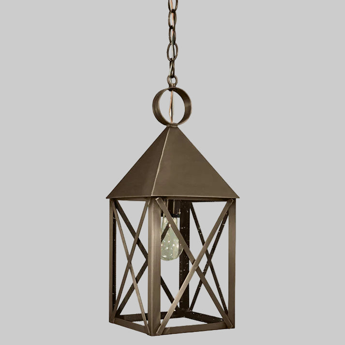 Bronze hanging lantern with a clear bulb on a gray background