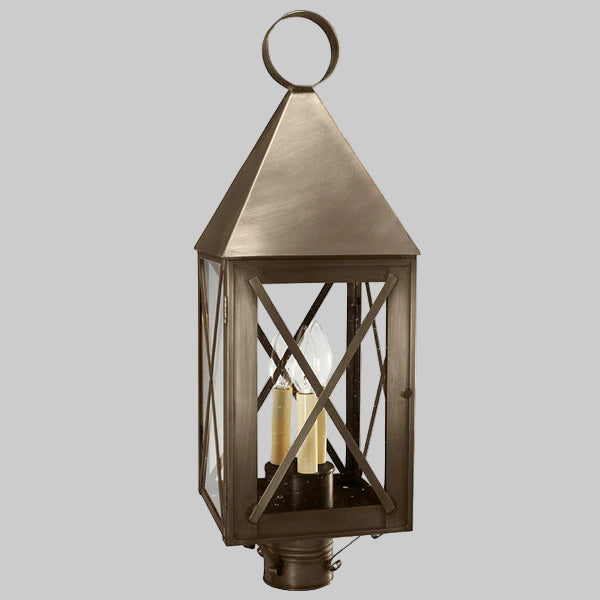 Bronze outdoor lantern with clear glass on a gray background