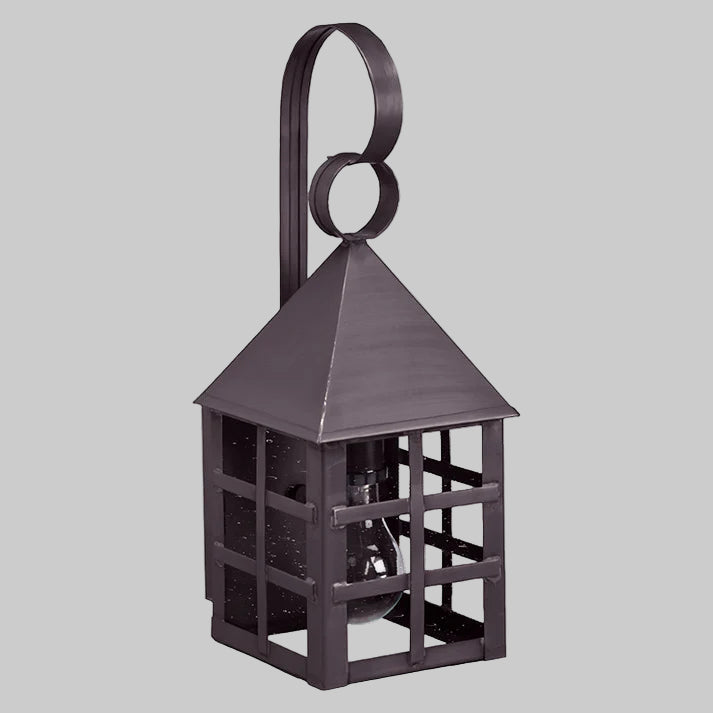 Decorative metal lantern with a handle on a gray background