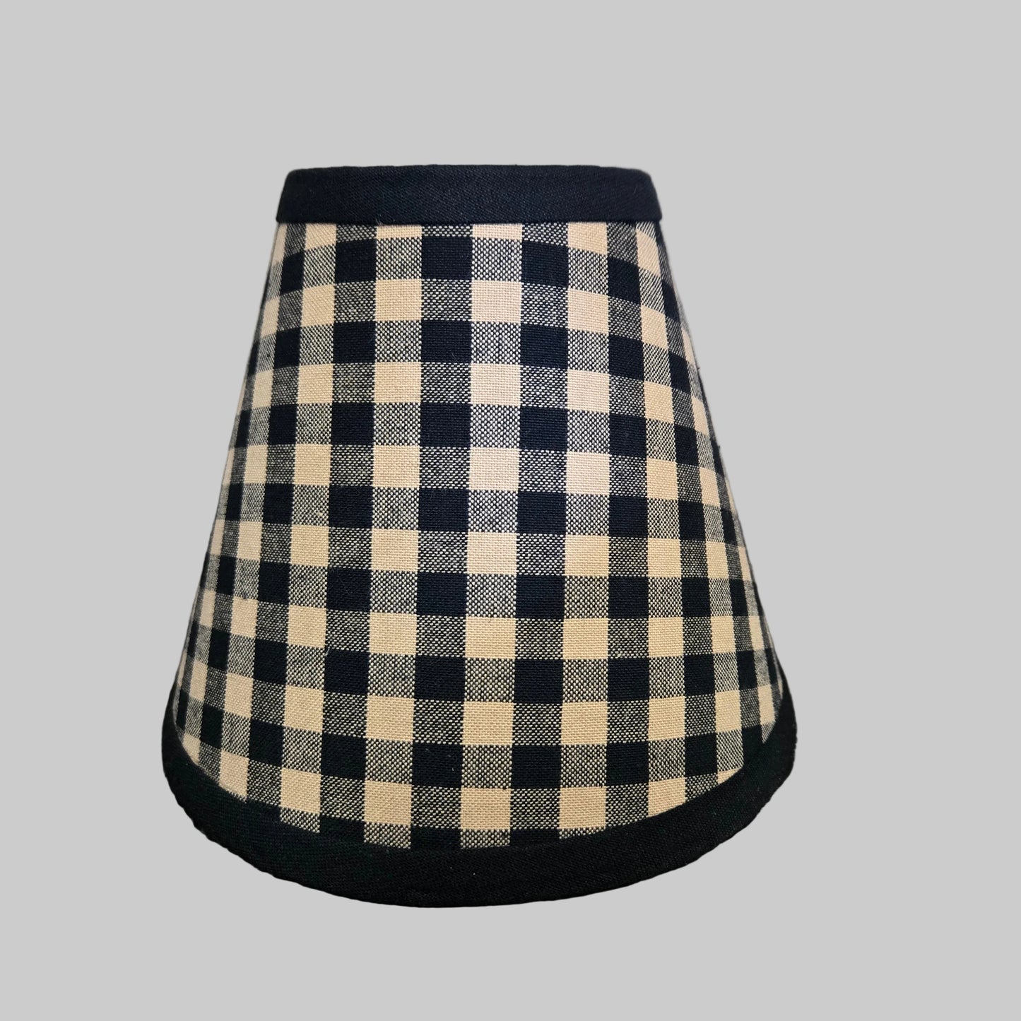 Plaid skirt with black trim on a gray background