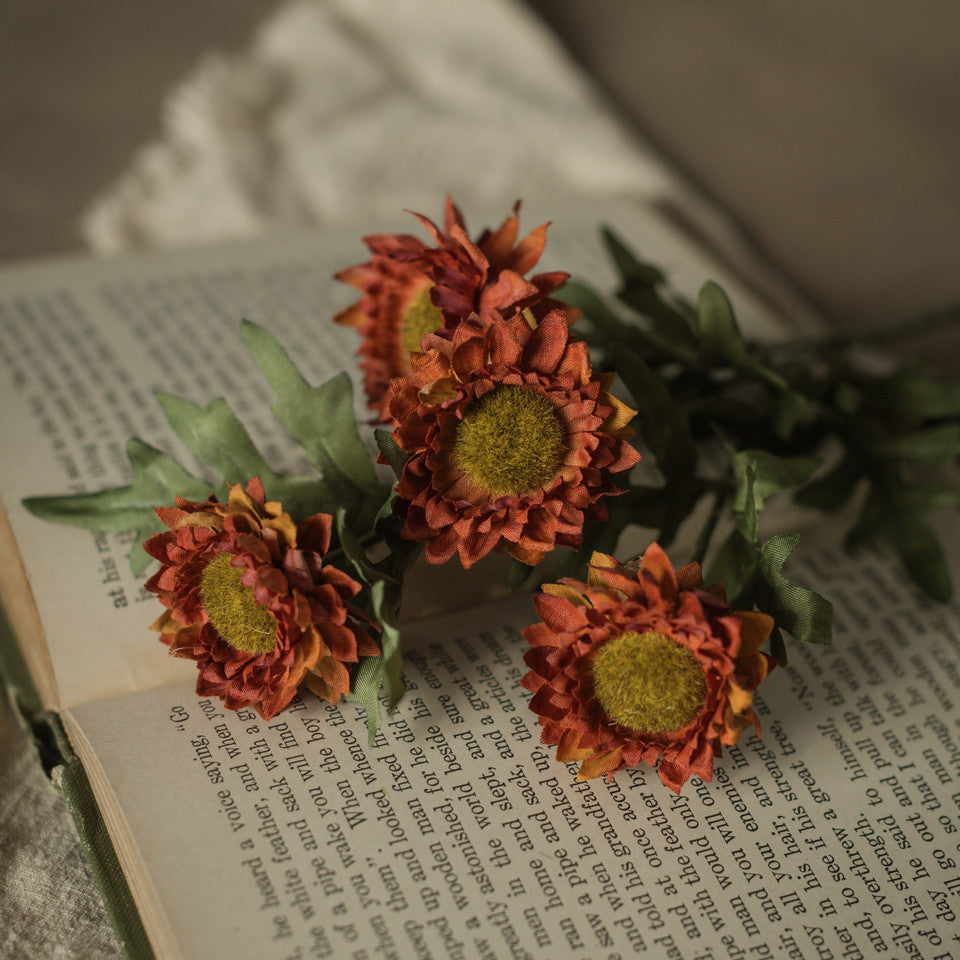 Bouquet of orange flowers on an open book
