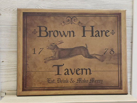 A canvas print featuring a traditional brown hare design with the text 'BROWN HARE TAVERN' and 'EAT. DRINK. & MAKE MERRY'.
