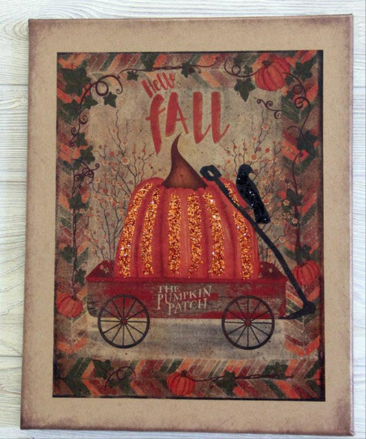 Canvas print with a wagon holding a pumpkin and crow with the words "Hello Fall"