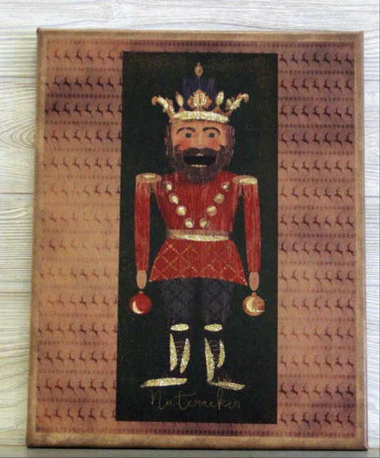 Canvas print with an illustration of a nutcracker with a crown surrounded by rows of prancing reindeer