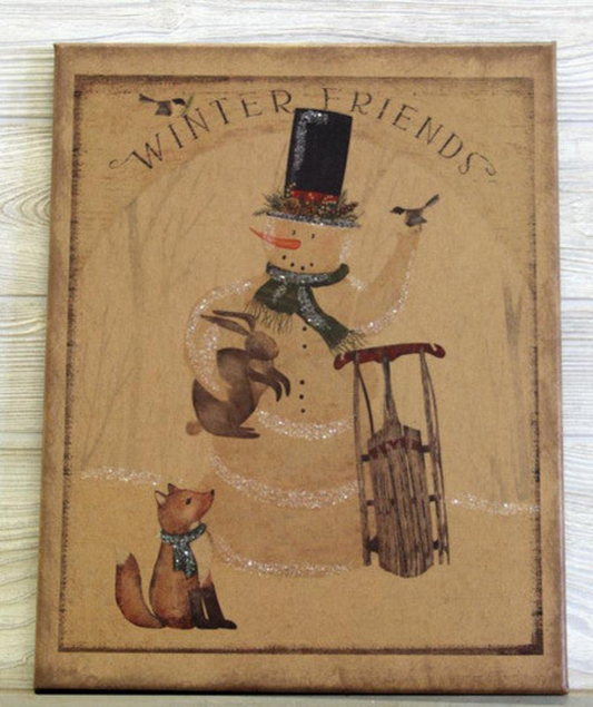 Canvas print with a snowman holding a bunny and sleigh with a fox standing next to him with the words "Winter Friends" above the scene