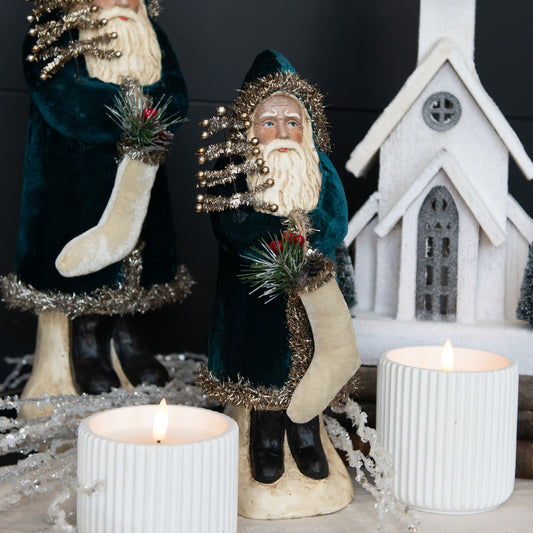 Deep ocean velvet belsnickel with candles and church in background.