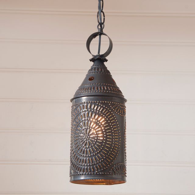Decorative hanging lantern with intricate design on a neutral background