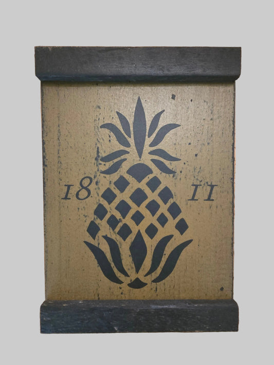 Decorative box with pineapple design and numbers '18' and '11' on a gray background
