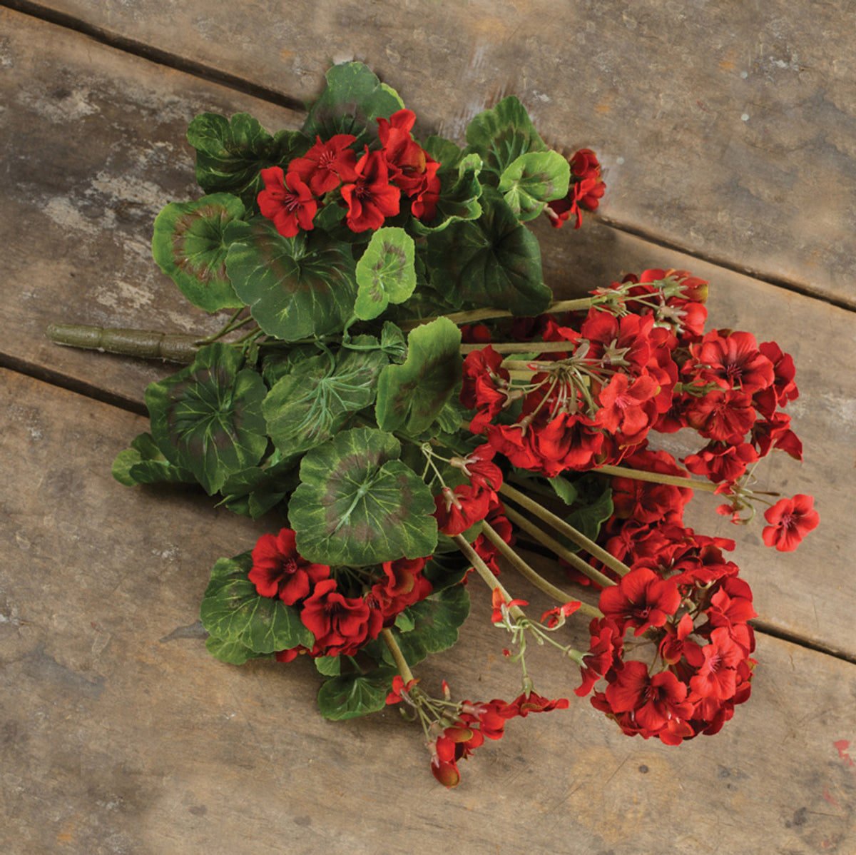 Floral pick on weathered wood planks.