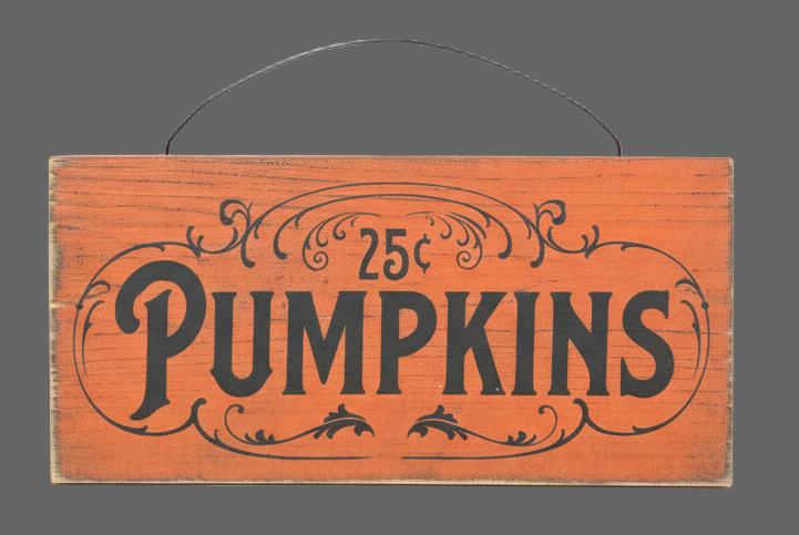 Wooden sign with '25c Pumpkins' text on a gray background