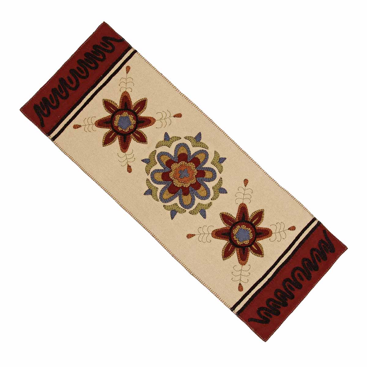 A beige cotton table runner with floral embroidery and decorative borders in brown and black colors.