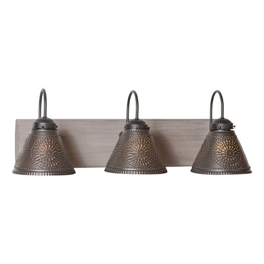 A rustic style three-light vanity light fixture with an Earl Gray painted finish and black tin shades.