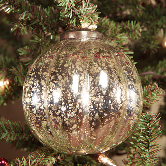 A 3-inch silver ridged mercury ornament hanging on a Christmas tree.