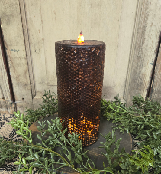 Battery operated pillar candle 3x7 that takes batteries and has a timer feature.