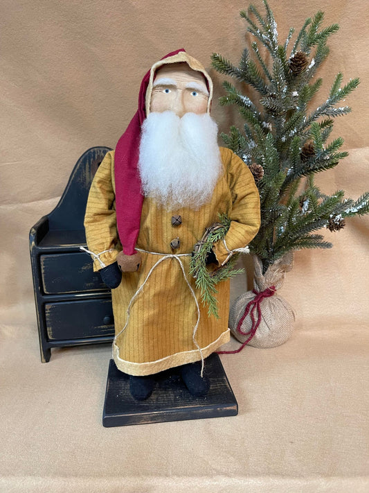 Primitive santa with wreath on arm