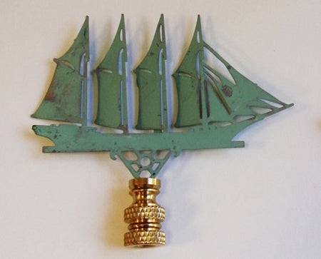 A copper lamp finial with a verdigris finish designed in the shape of a 4 masted schooner.
