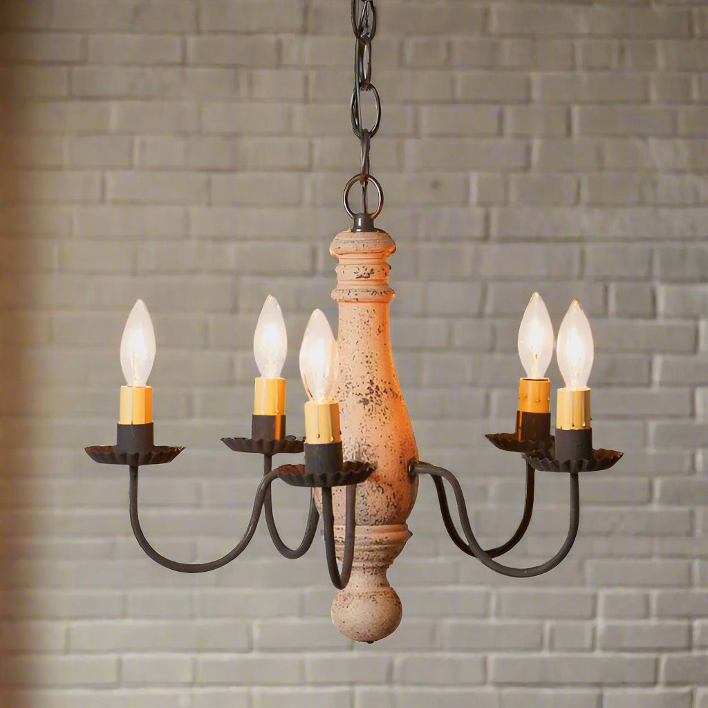 Five light primitive chandelier with a buttermilk paint finish on a white background.