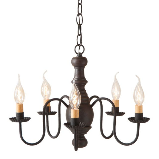 A black, wooden chandelier with five hanging lights and a textured finish, featuring crimped pans and a chain-driven mounting system.