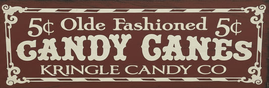 Vintage-style sign advertising '5¢ Olde Fashioned 5¢ GANDY CANES' from Kringle Candy Co.