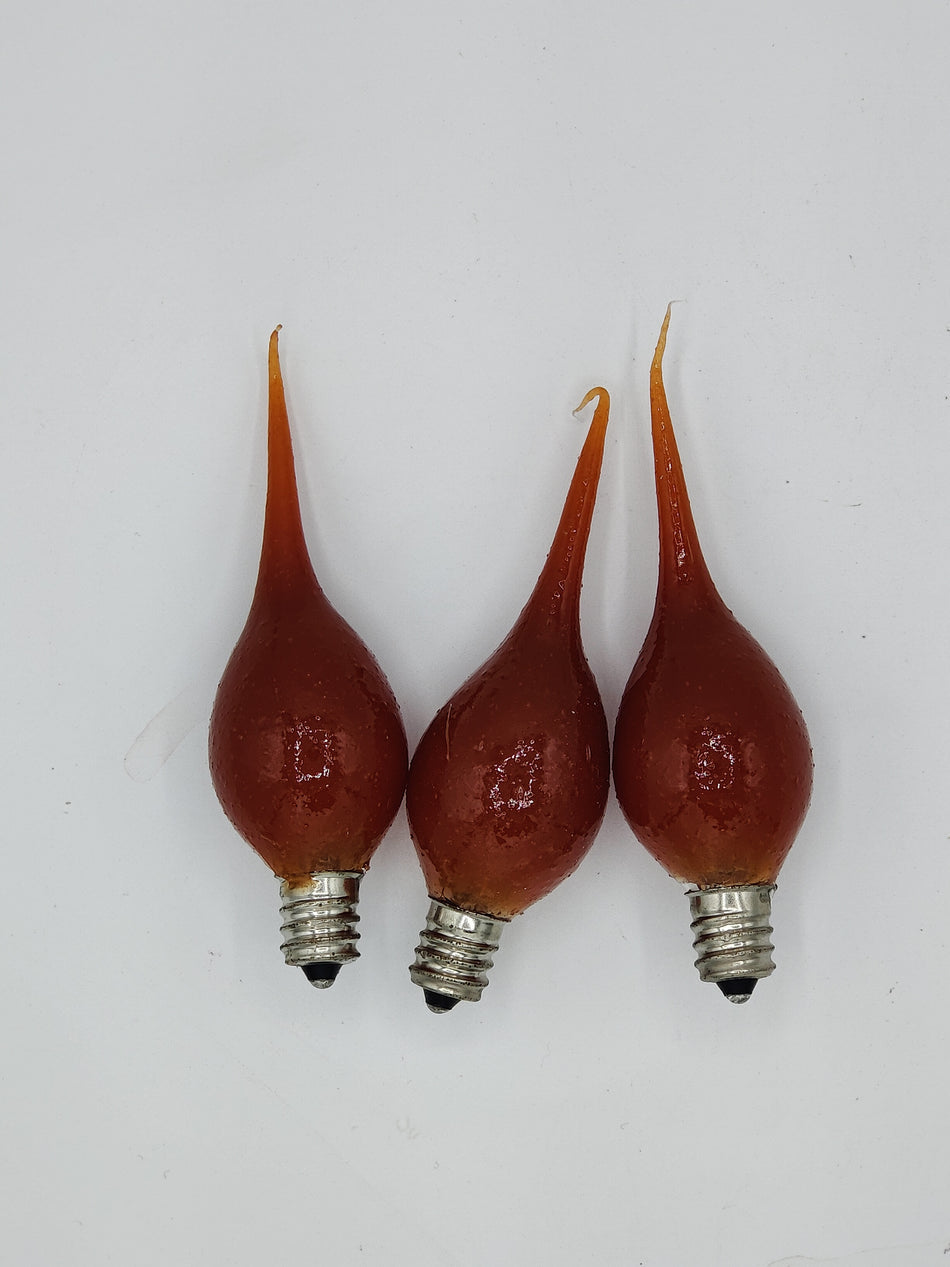 Three silicone bulbs with a brown tint and a visible cinnamon stick scent, placed against a white background.